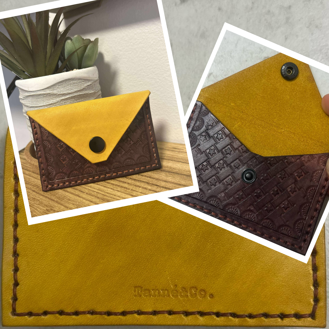 Tanné & Co.'s Ambassador Card Case featuring a hand-tooled basket weave pattern with a star detail, crafted in dark brown hand-dyed veg-tan leather and paired with an Eco-Flo Sunshine Yellow dyed backing. This premium leather card holder showcases artisan precision, functional design, and the rich texture of genuine vegetable-tanned leather.
