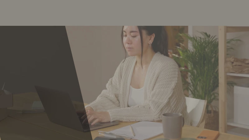 Background video showing customers interacting via laptop, phone, and tablet — representing communication with Tanné & Co.